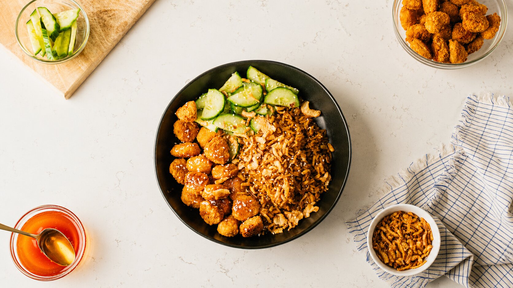 Crispy Chicken Hot Honey Bowl with Cucumber, Crispy Onions & Sesame